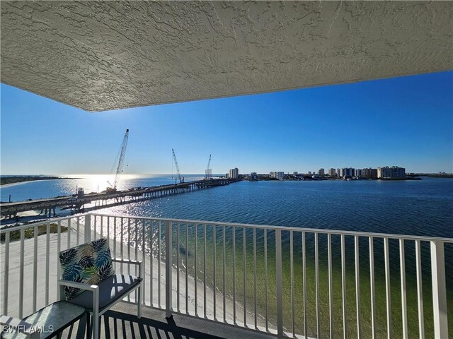 balcony featuring a water view