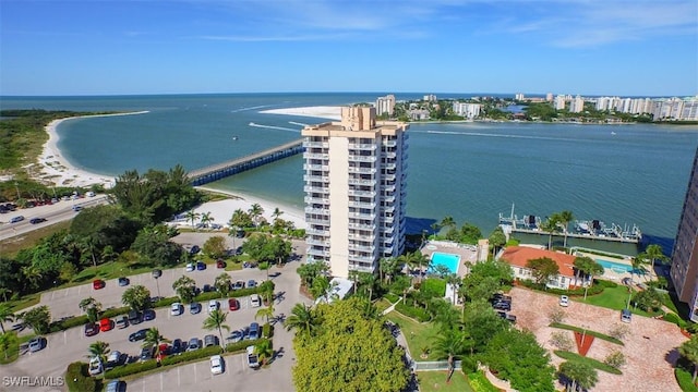 bird's eye view featuring a beach view and a water view