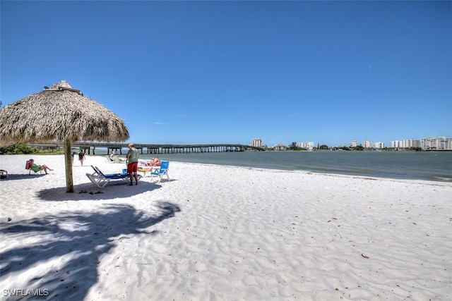 water view with a gazebo and a view of the beach