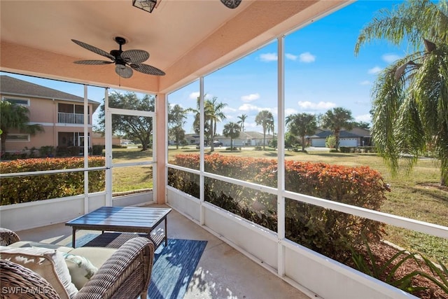 sunroom / solarium with ceiling fan and a healthy amount of sunlight