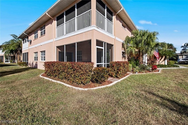 view of property exterior with a lawn