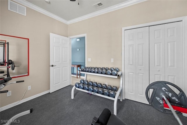 workout room with crown molding and dark carpet