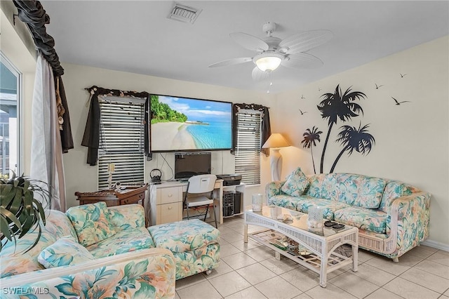 tiled living room featuring ceiling fan