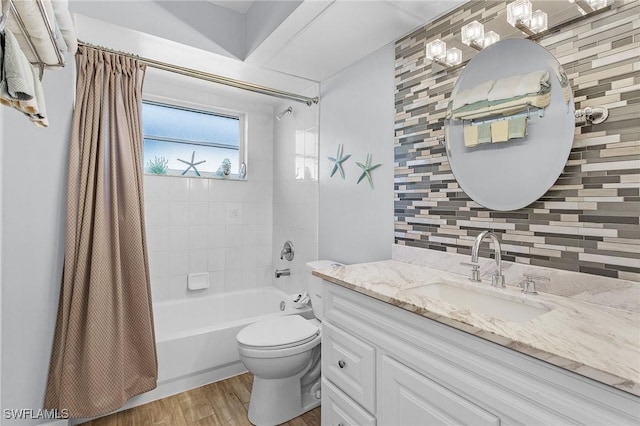 full bathroom with backsplash, vanity, shower / bathtub combination with curtain, hardwood / wood-style floors, and toilet