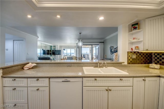 kitchen featuring white dishwasher, sink, ornamental molding, tasteful backsplash, and light stone counters