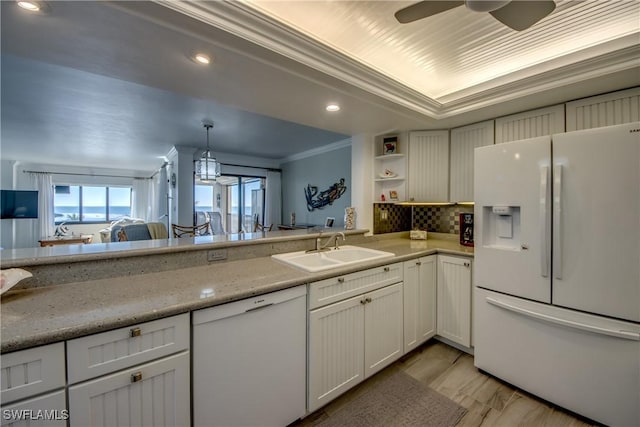 kitchen with white cabinetry, sink, pendant lighting, white appliances, and ornamental molding