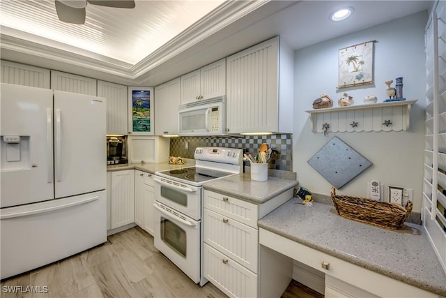 kitchen with white cabinetry, light stone counters, white appliances, and tasteful backsplash