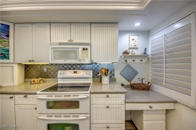 kitchen with white appliances, tasteful backsplash, white cabinetry, and light stone counters