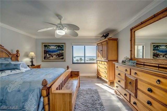 bedroom featuring ceiling fan, crown molding, and light hardwood / wood-style flooring