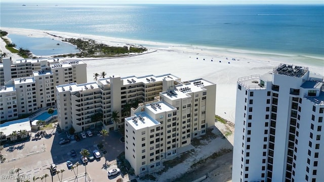 aerial view featuring a water view and a beach view