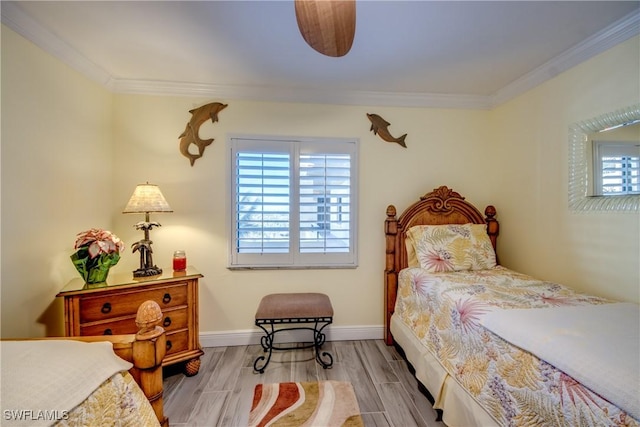 bedroom featuring light hardwood / wood-style floors and ornamental molding