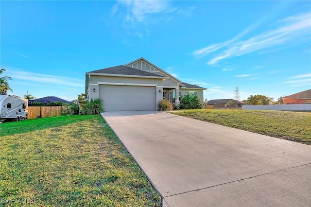 single story home featuring a garage and a front yard