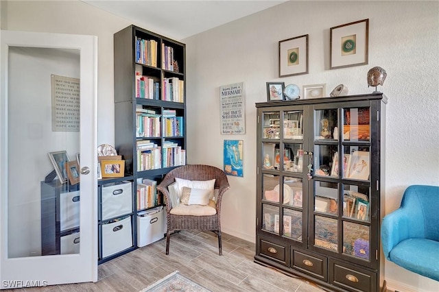 living area with hardwood / wood-style flooring