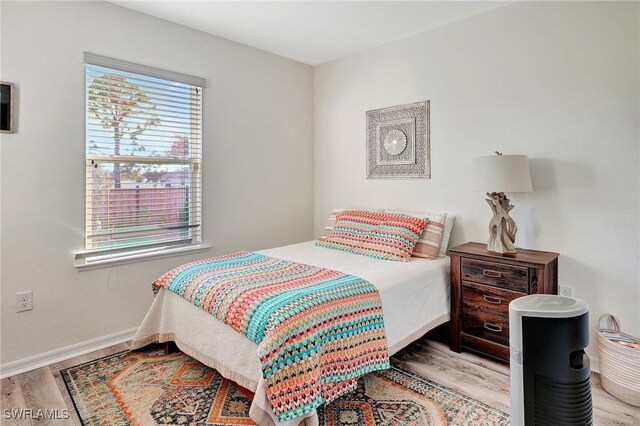 bedroom featuring light hardwood / wood-style floors