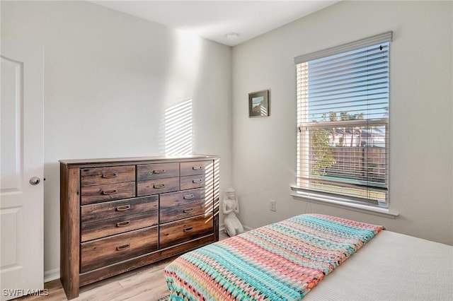 bedroom featuring light wood-type flooring