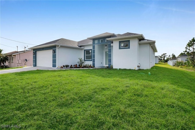 view of front facade featuring a front lawn and a garage