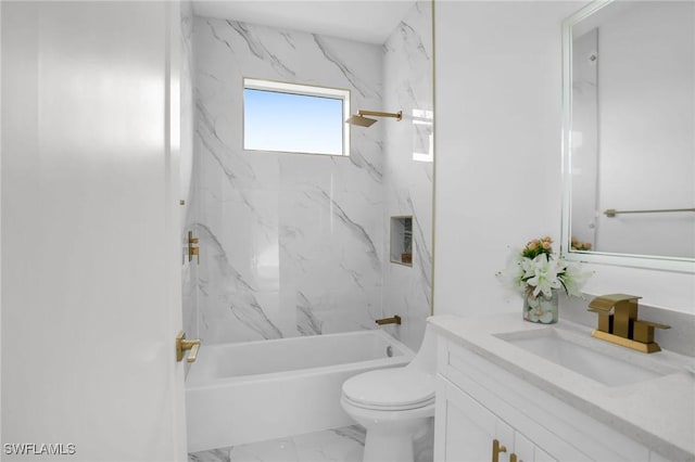 full bathroom with toilet, vanity, and tiled shower / bath