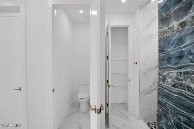 bathroom with toilet and walk in shower