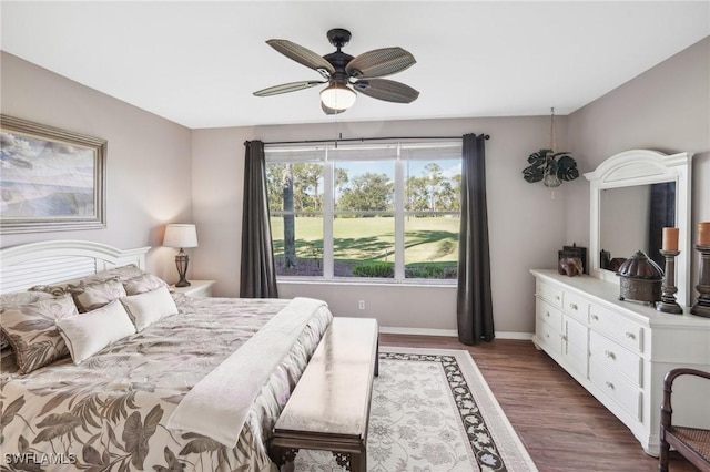 bedroom featuring dark wood-type flooring and ceiling fan