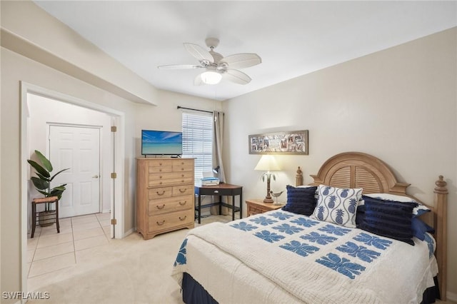 tiled bedroom featuring ceiling fan