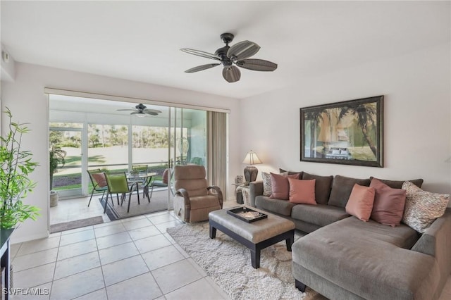 living room featuring light tile patterned flooring, a wealth of natural light, and ceiling fan