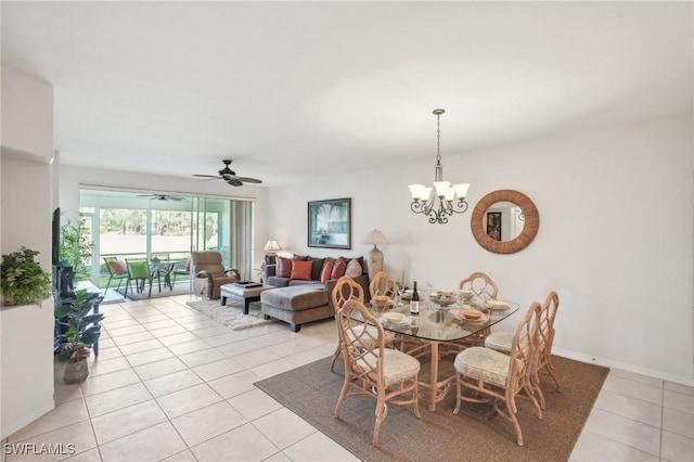 dining area with ceiling fan with notable chandelier and light tile patterned floors