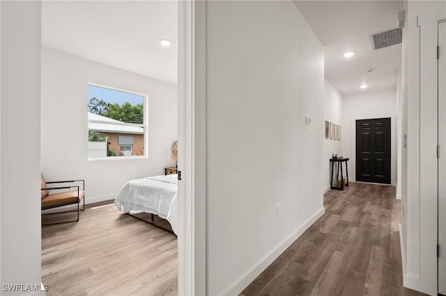 corridor featuring light hardwood / wood-style floors