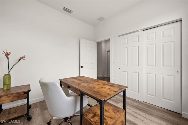 home office featuring light hardwood / wood-style floors