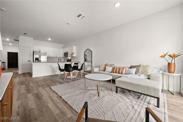 living room featuring light hardwood / wood-style flooring