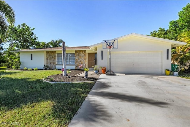 ranch-style home featuring a front lawn and a garage