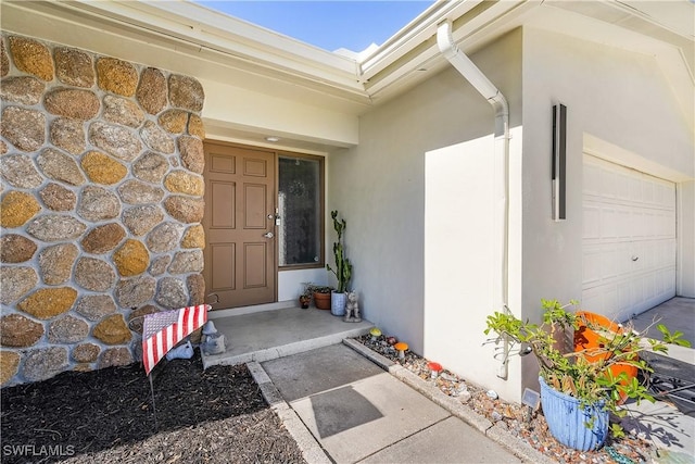 doorway to property featuring a garage