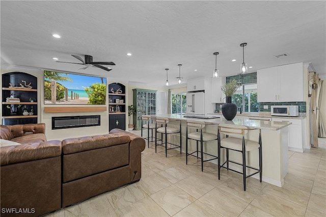 living room featuring ceiling fan