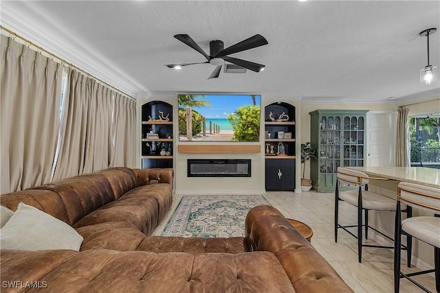 tiled living room featuring ceiling fan, a textured ceiling, and ornamental molding