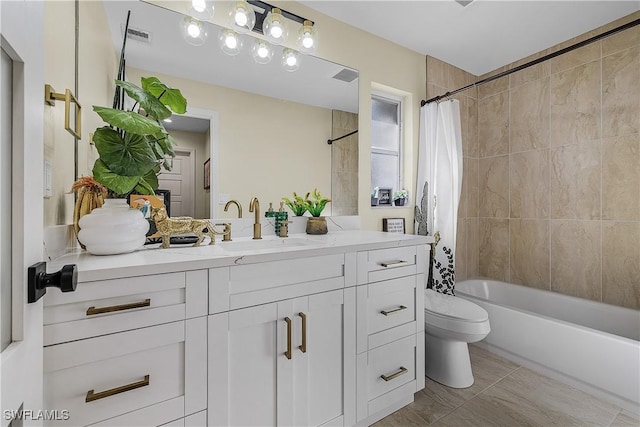 full bathroom featuring tile patterned flooring, shower / bath combo, vanity, and toilet