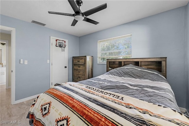 bedroom featuring light colored carpet and ceiling fan