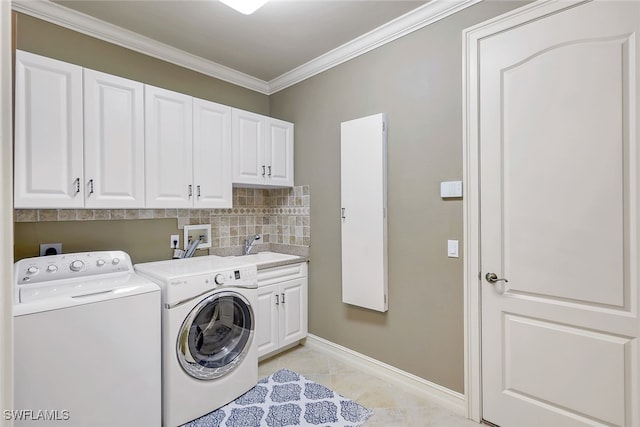 laundry area with cabinets, sink, ornamental molding, independent washer and dryer, and light tile patterned flooring