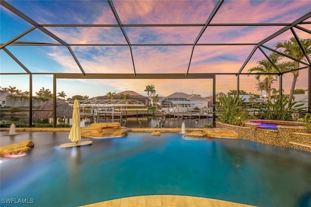 pool at dusk with glass enclosure and a water view