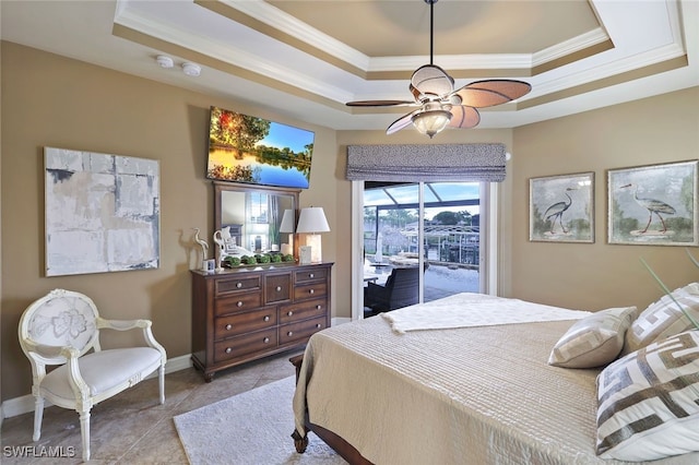 tiled bedroom with ceiling fan, a tray ceiling, ornamental molding, and access to outside