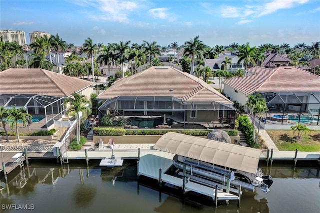 dock area featuring a lanai and a water view