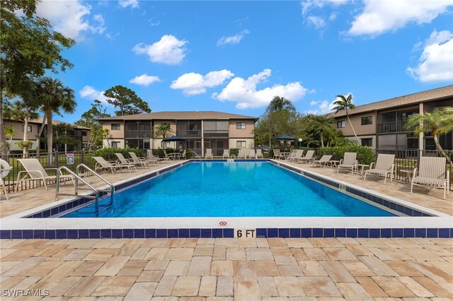 view of swimming pool featuring a patio area
