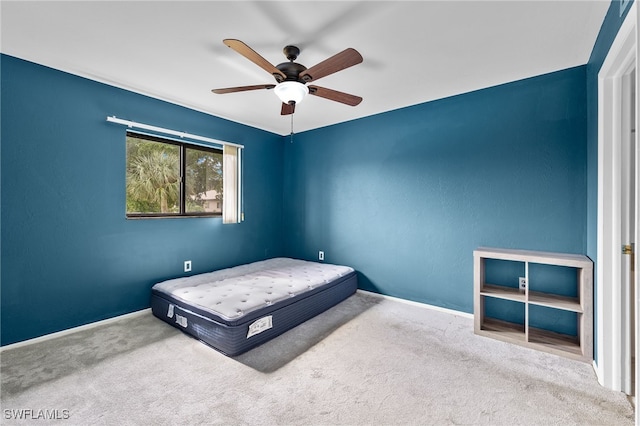 bedroom with ceiling fan and carpet floors
