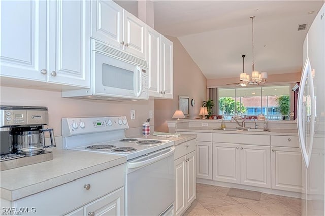 kitchen with lofted ceiling, white cabinetry, white appliances, and hanging light fixtures