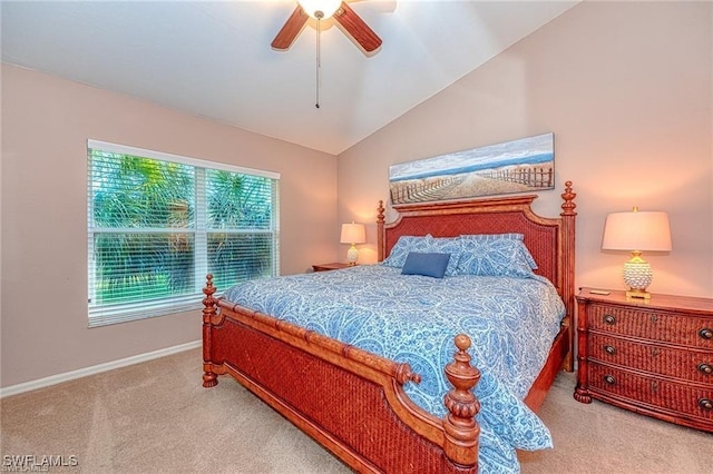 bedroom featuring ceiling fan, light carpet, and vaulted ceiling