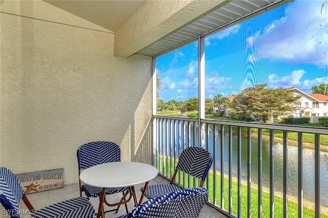 balcony featuring a water view