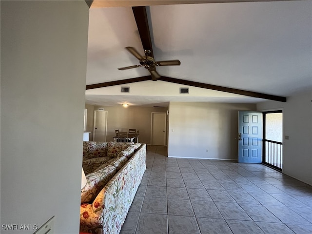 unfurnished living room featuring vaulted ceiling with beams, ceiling fan, and tile patterned flooring