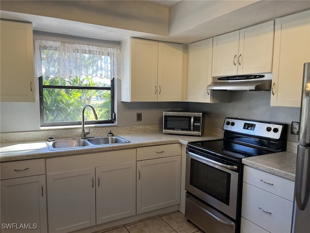 kitchen featuring white cabinetry, light tile patterned floors, sink, and appliances with stainless steel finishes