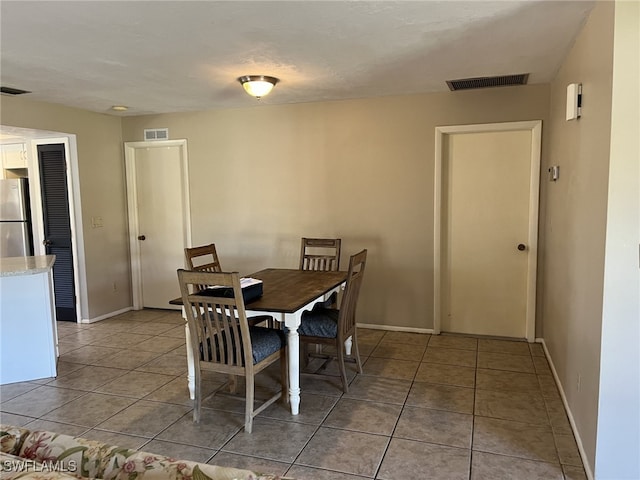 view of tiled dining space