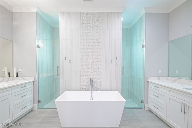 bathroom with crown molding, vanity, and shower with separate bathtub