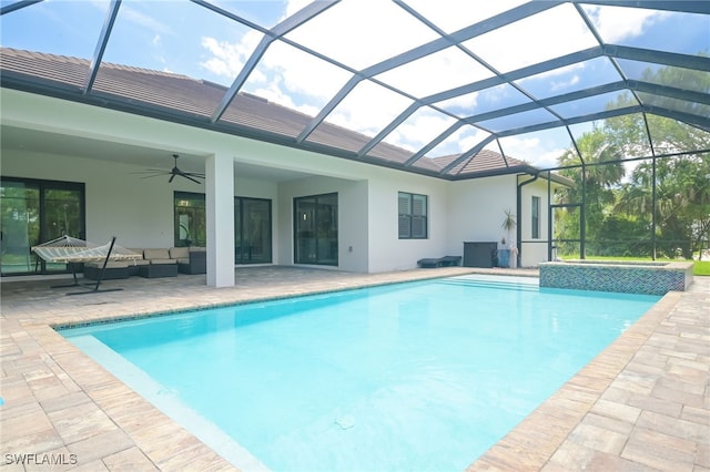 view of pool with ceiling fan, a lanai, an outdoor hangout area, and a patio