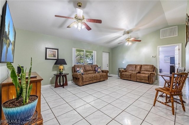 tiled living room with vaulted ceiling